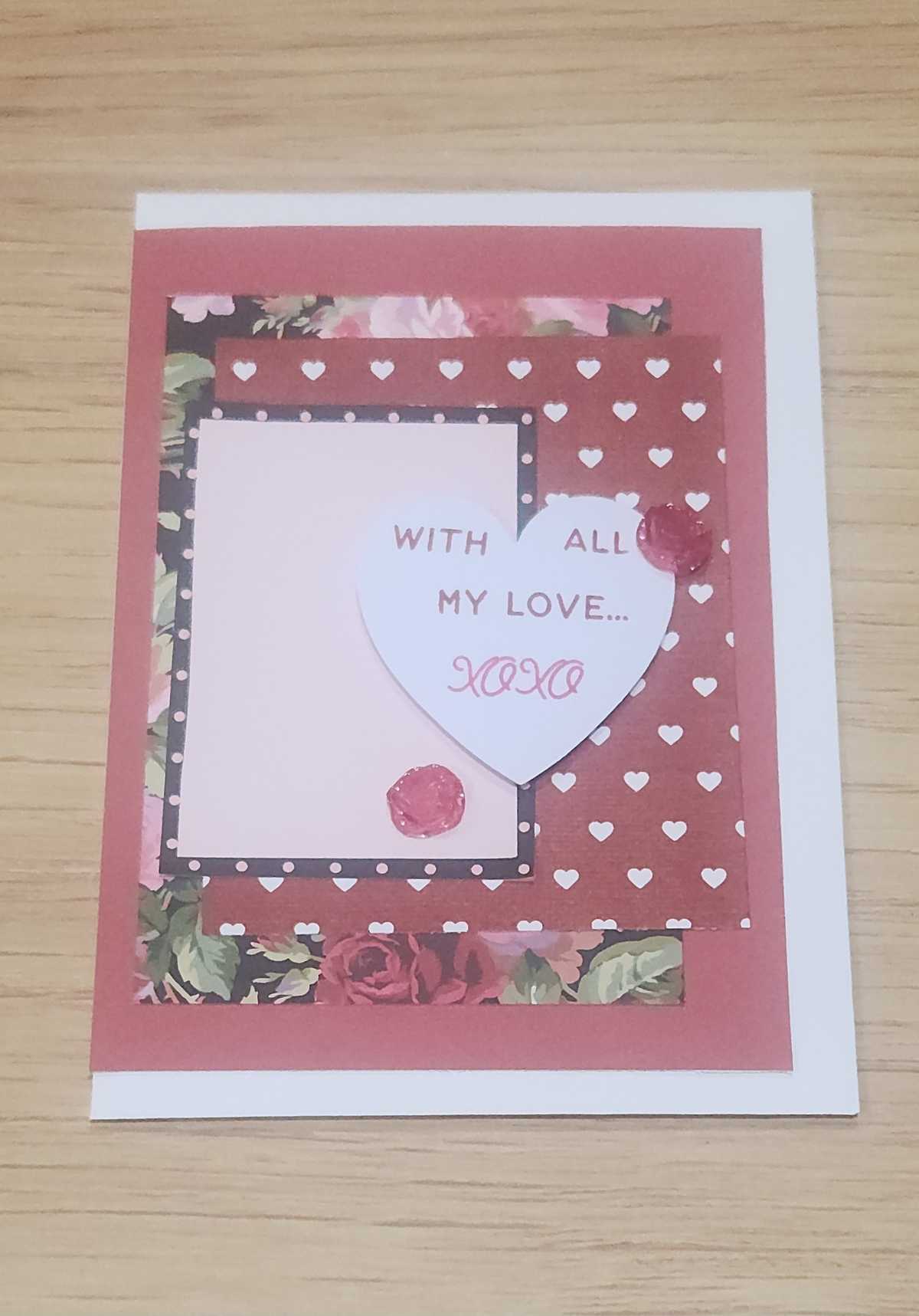 Handmade love card featuring patterned paper, heart cutout, and sentiment 'With All My Love'.