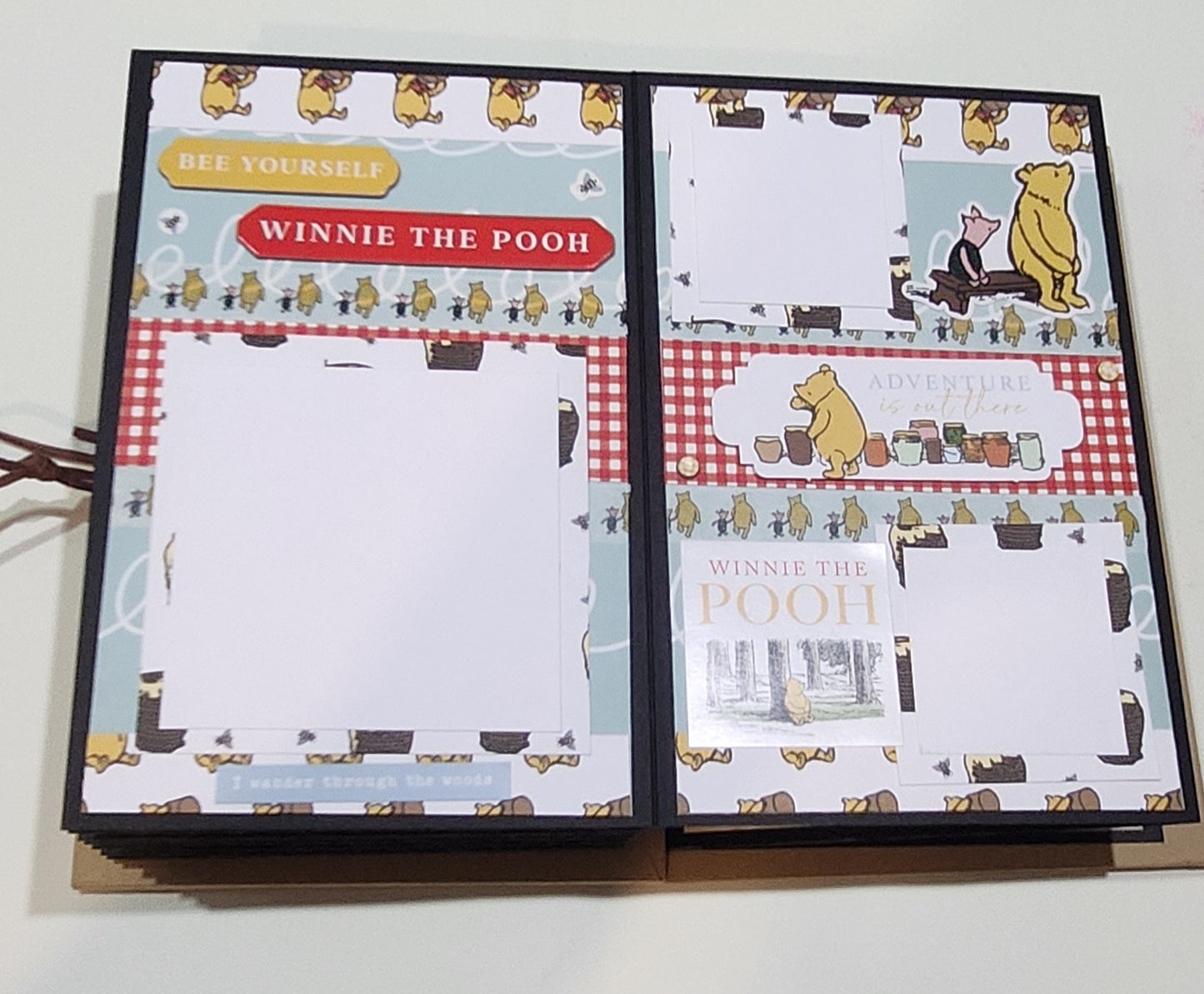 Winnie the Pooh-themed photo book page
