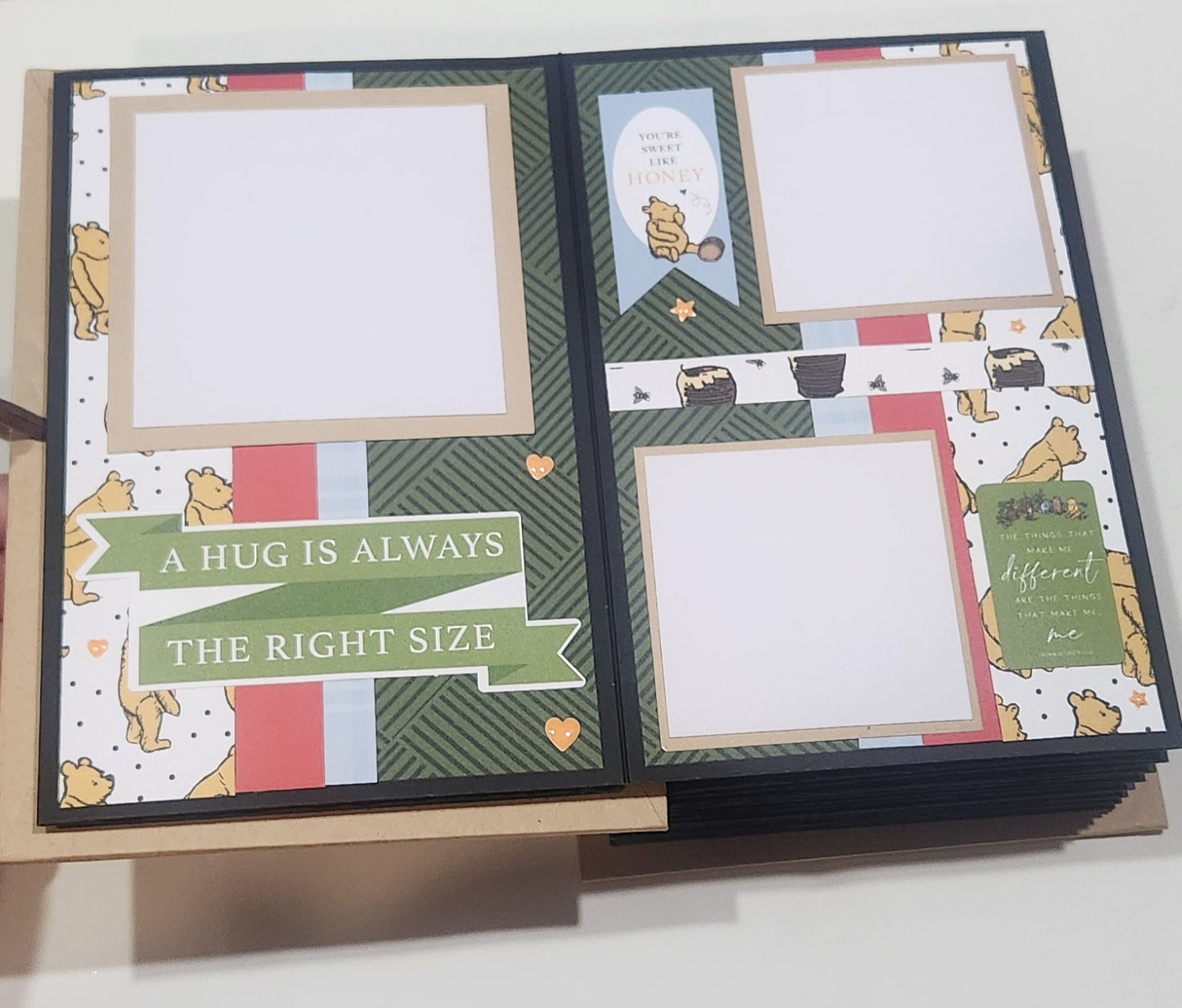 Winie the Pooh page with text 'A hug is always the right size'.