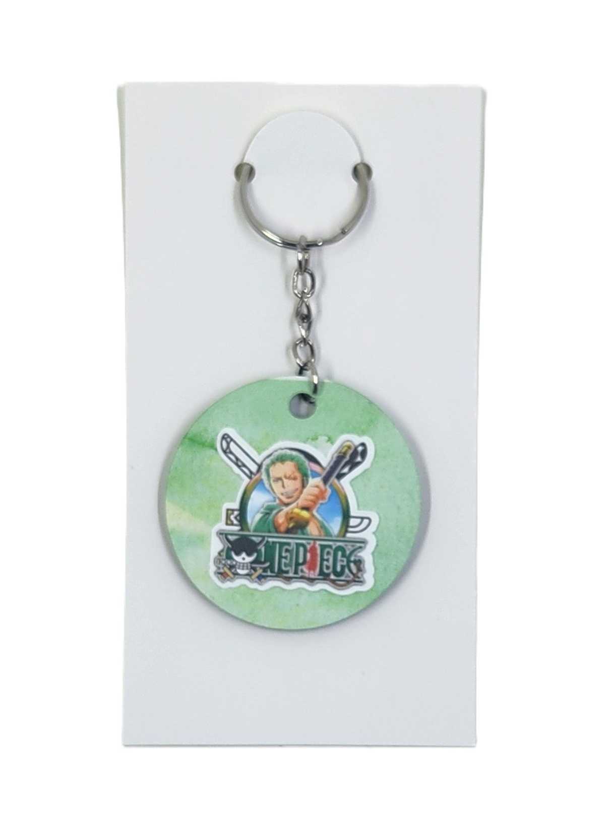 Keychain with circular design featuring a character and text on a white background
